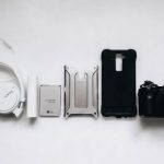 Tech Gadgets - white Sony headphones and black smartphone case