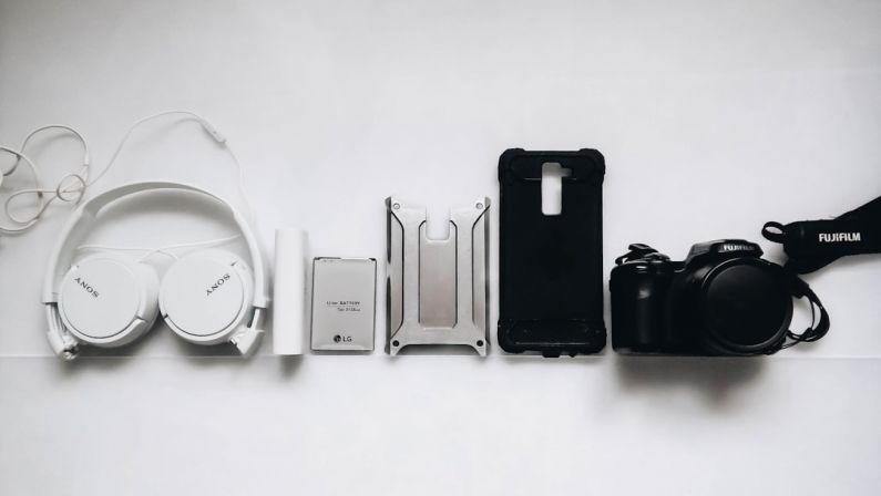 Tech Gadgets - white Sony headphones and black smartphone case