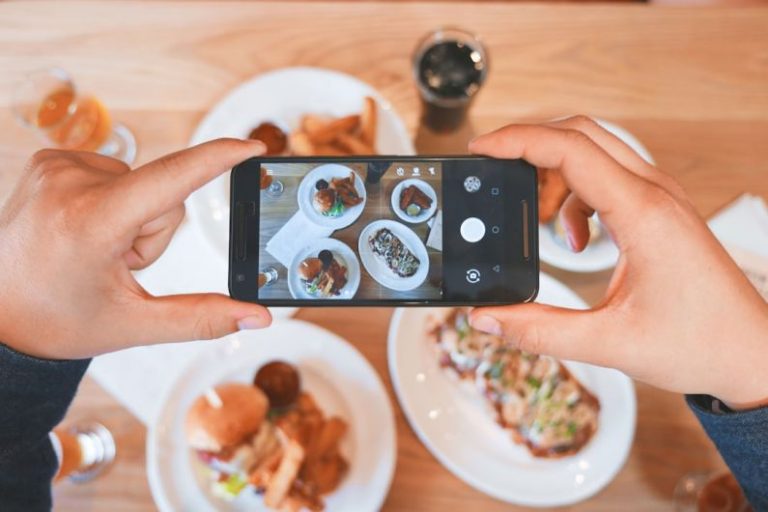 Smartphone Camera - person taking picture of the foods