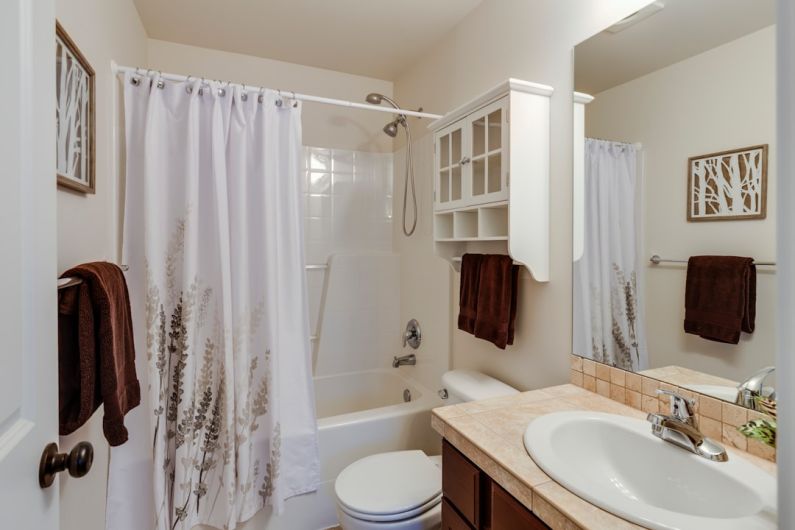 Small Bathroom - rectangular brown and white sink